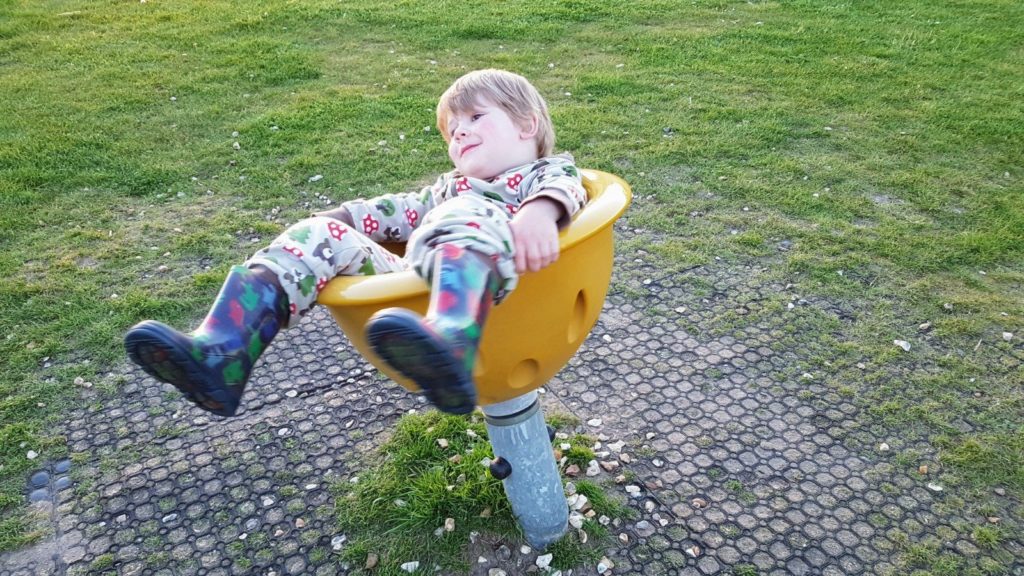 toddler in spinning chair